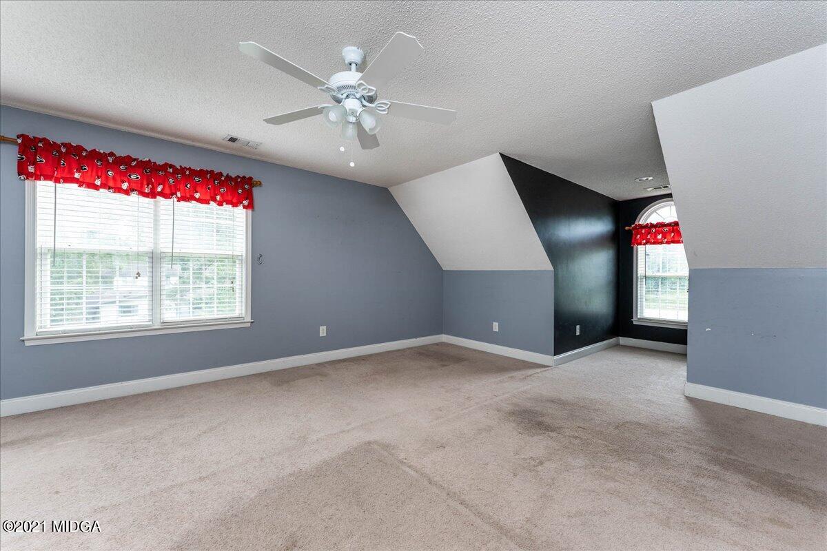 7455 Columbus Road Lizella, GA 31052 - Photo 27 of 32 a view of an empty room with a window
