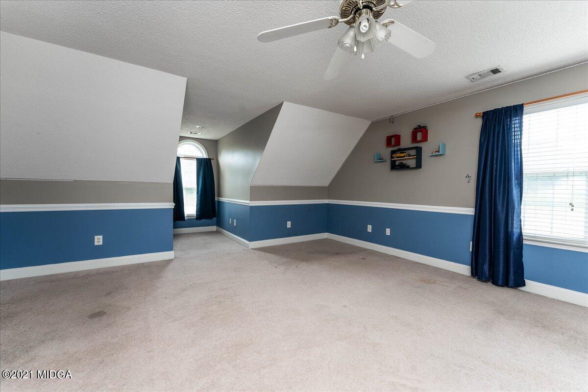 7455 Columbus Road Lizella, GA 31052 - Photo 31 of 32 wooden floor in an empty room with a window