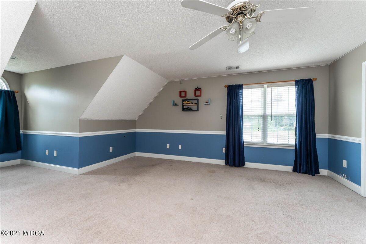 7455 Columbus Road Lizella, GA 31052 - Photo 32 of 32 a view of an empty room with a window