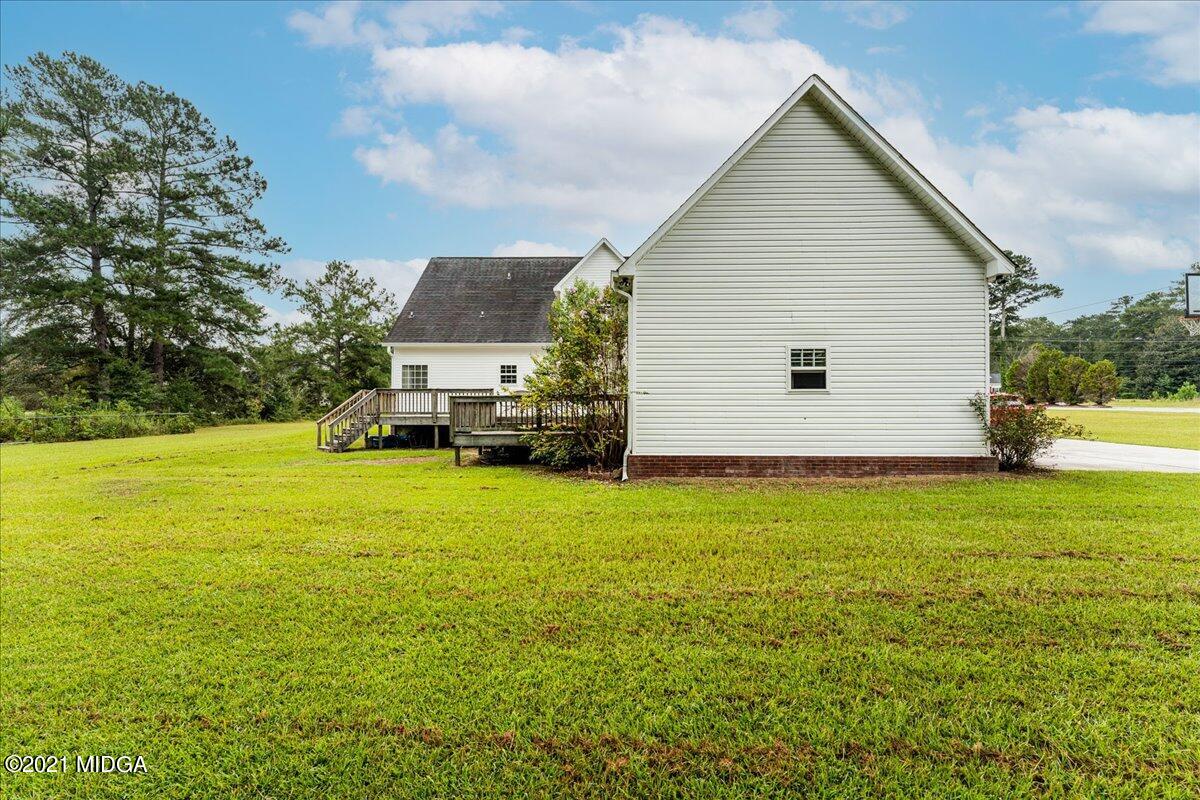 7455 Columbus Road Lizella, GA 31052 - Photo 9 of 32 a view of a house with a yard