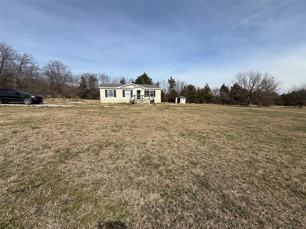 6100 Preston Road Denison, TX 75020 - Photo 20 of 20 a view of a houses with yard and lake view