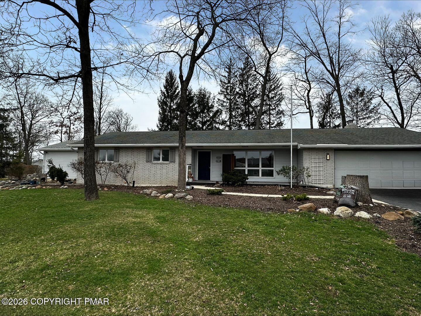 1055 Pine Tree Drive Slatington, PA 18080 - Photo 2 of 38 a front view of house with yard and seating area