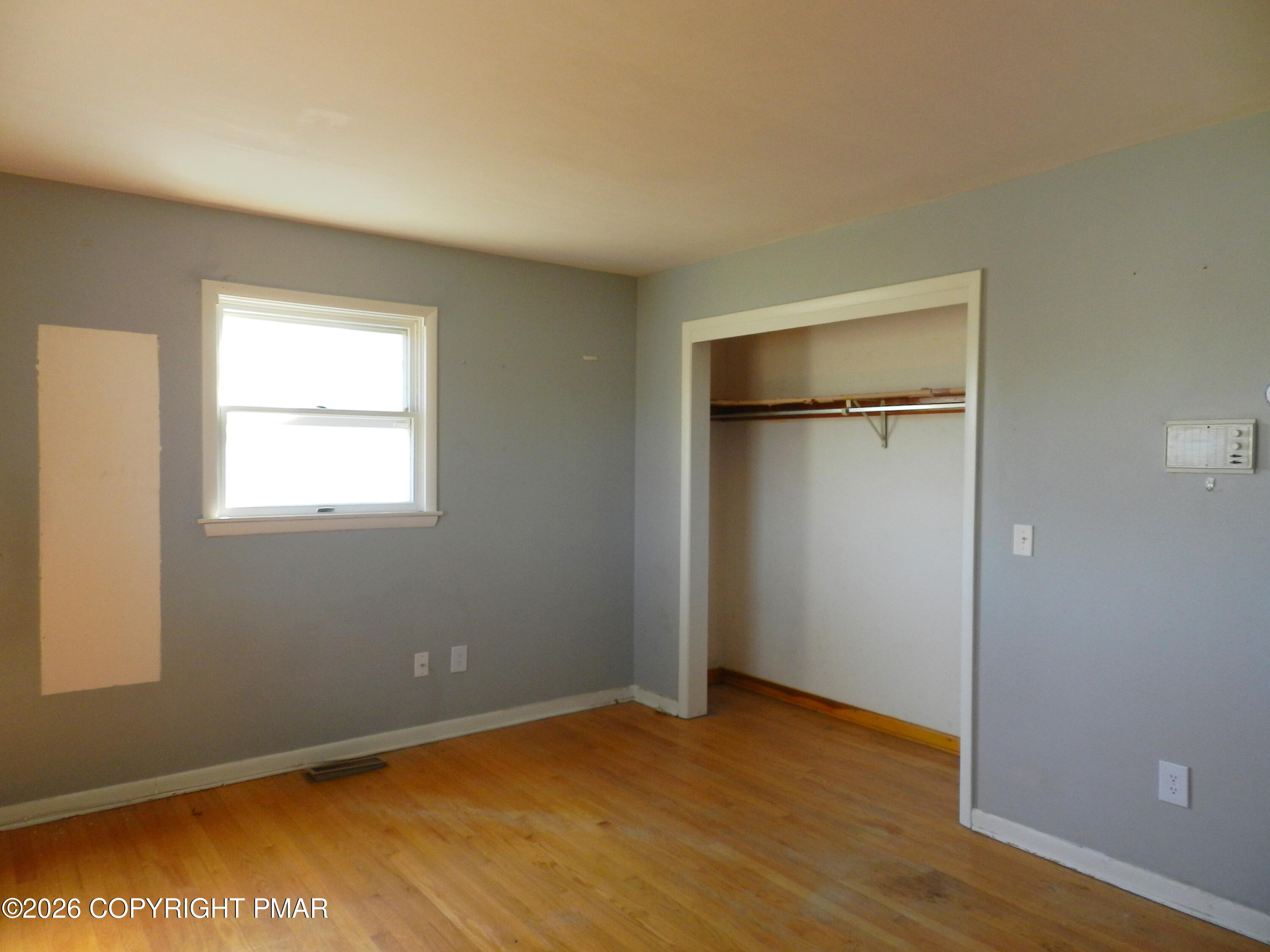 1055 Pine Tree Drive Slatington, PA 18080 - Photo 22 of 38 an empty room with closet and windows