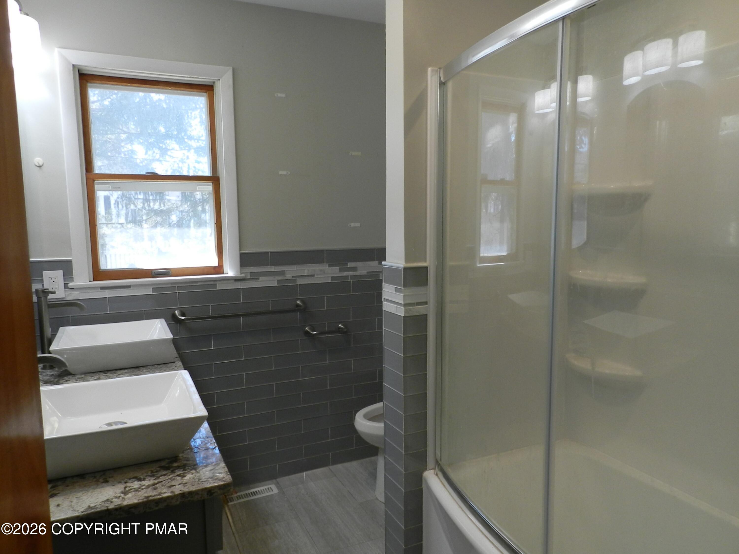 1055 Pine Tree Drive Slatington, PA 18080 - Photo 23 of 38 a bathroom with a shower and a toilet