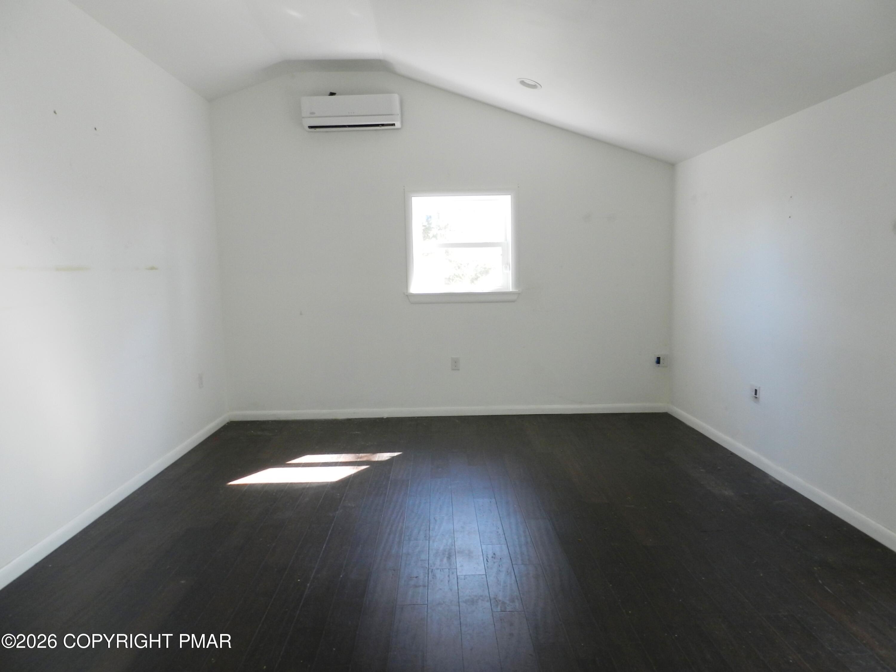 1055 Pine Tree Drive Slatington, PA 18080 - Photo 24 of 38 an empty room with wooden floor and windows