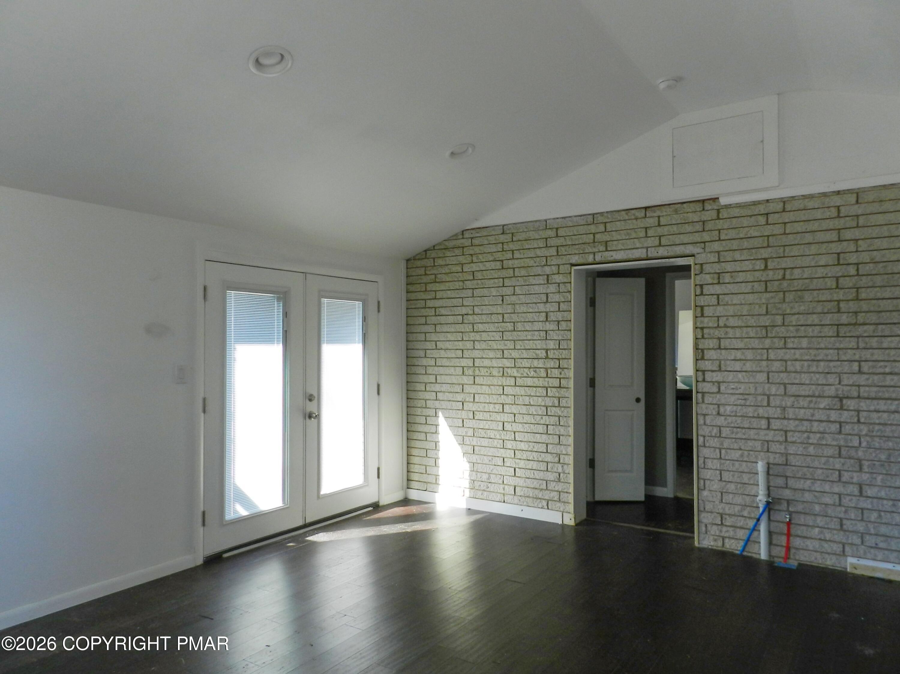 1055 Pine Tree Drive Slatington, PA 18080 - Photo 27 of 38 a view of an empty room with wooden floor and a window