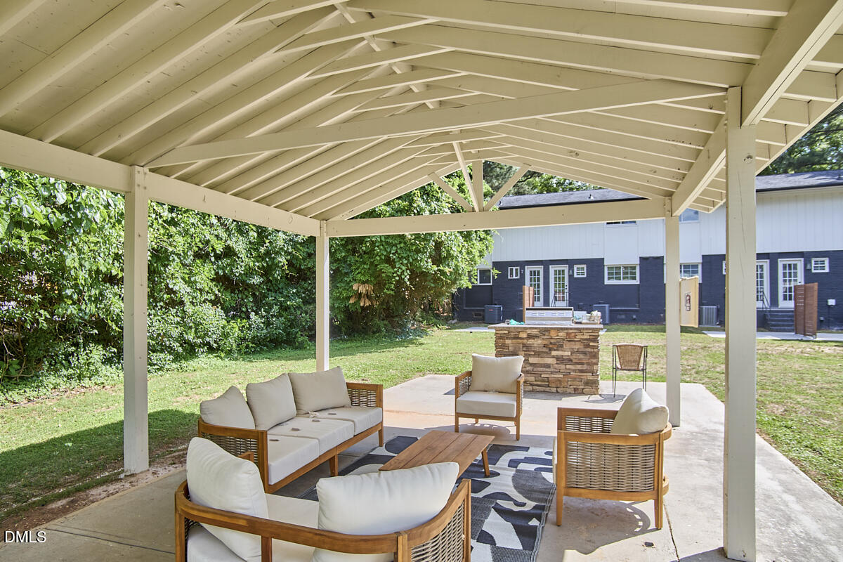 2613 McNeil Street, Unit E Raleigh, NC 27608 - Photo 28 of 28 a patio with yard table and chairs