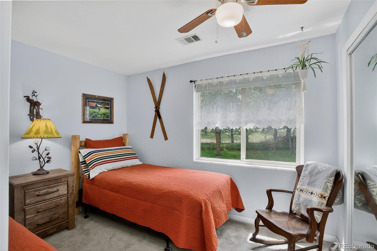 29656 Buffalo Park Road, Unit 209 Evergreen, CO 80439 - Photo 12 of 22 a bedroom with a bed and a window