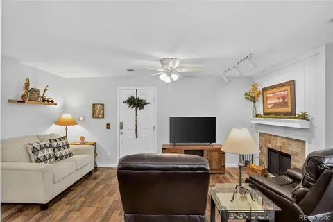 a living room with furniture fireplace and a flat screen tv