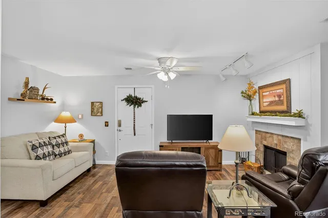 a living room with furniture fireplace and a flat screen tv