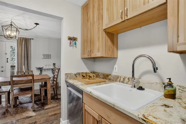 a kitchen with a sink and a stove top oven