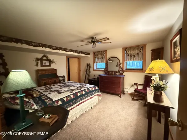 a living room with a couch and a chandelier