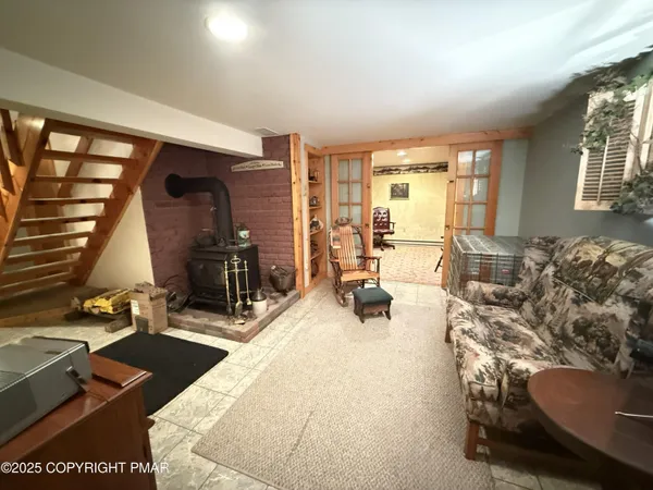 a bedroom with furniture and a flat screen tv