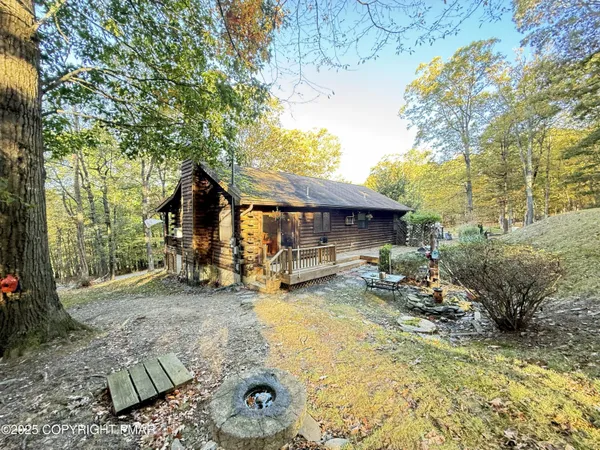 a view of a house with backyard porch and sitting area