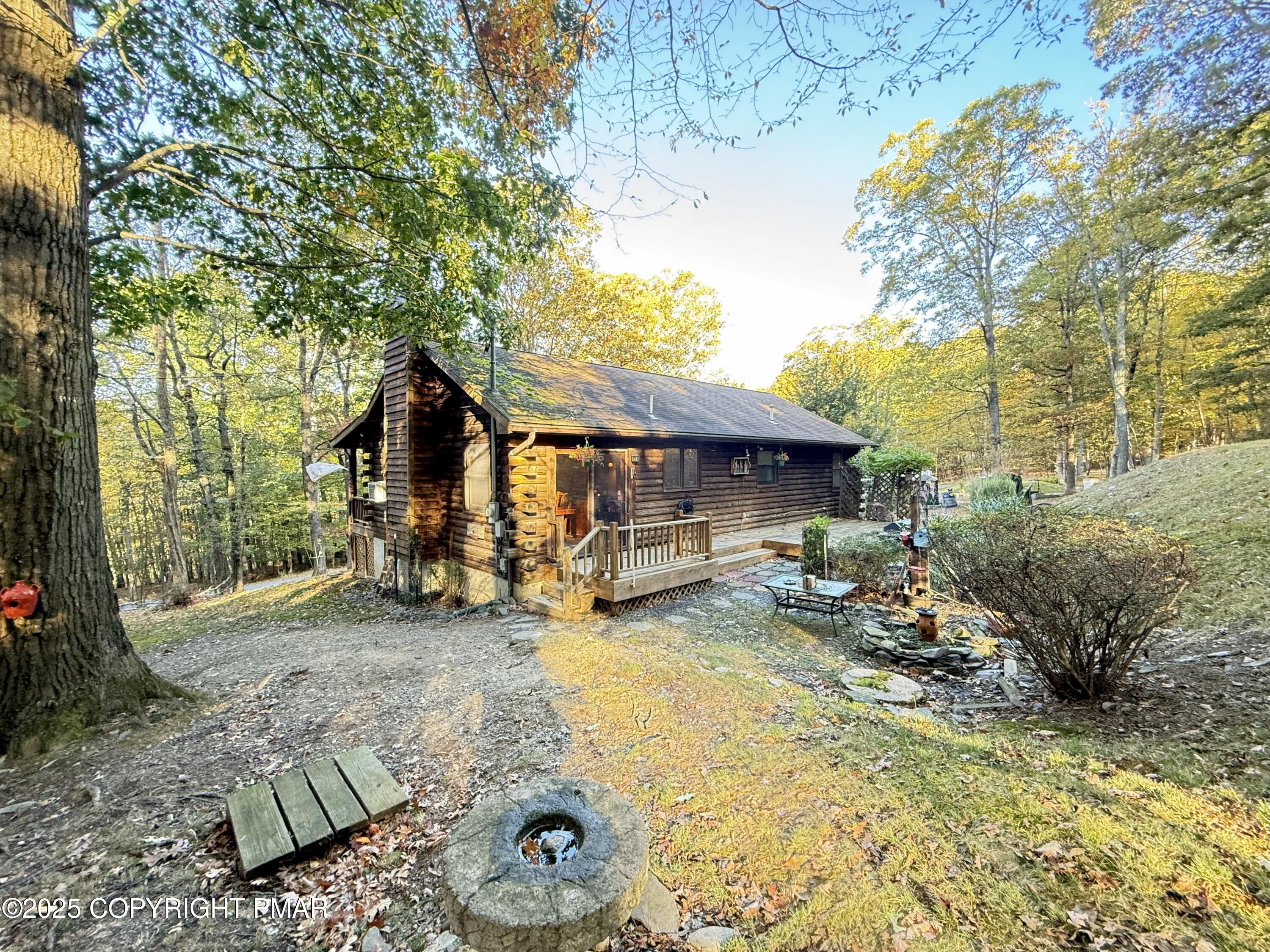 2119 Meadow Lark Circle Bushkill, PA 18324 - Photo 2 of 34 a view of a house with backyard porch and sitting area