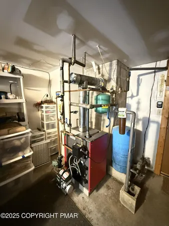 a view of a house with a small yard and wooden fence