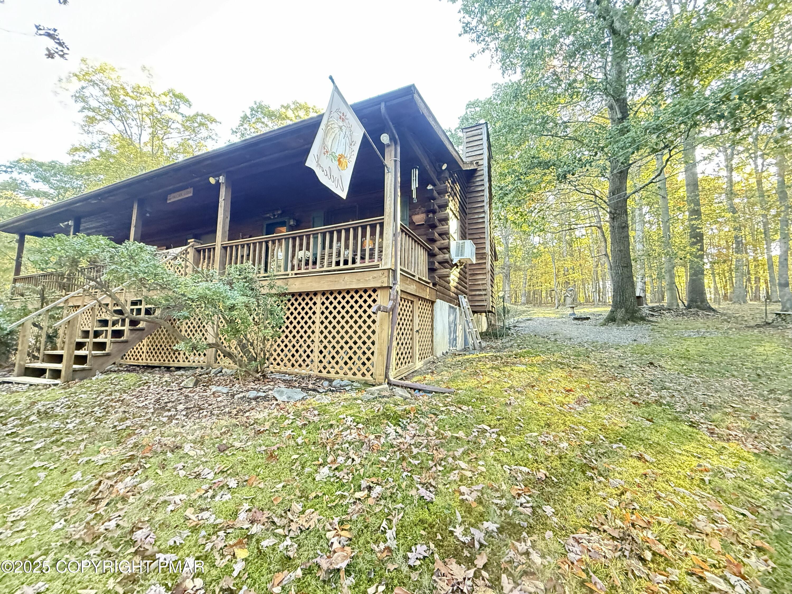 2119 Meadow Lark Circle Bushkill, PA 18324 - Photo 24 of 34 a view of a house with a small yard and wooden fence