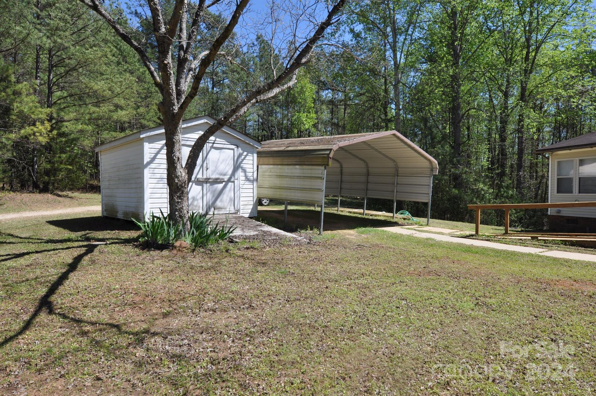 1646 Madison Road, Unit 22 Chester, SC 29706 - Photo 2 of 24 a house with a trees in front of it