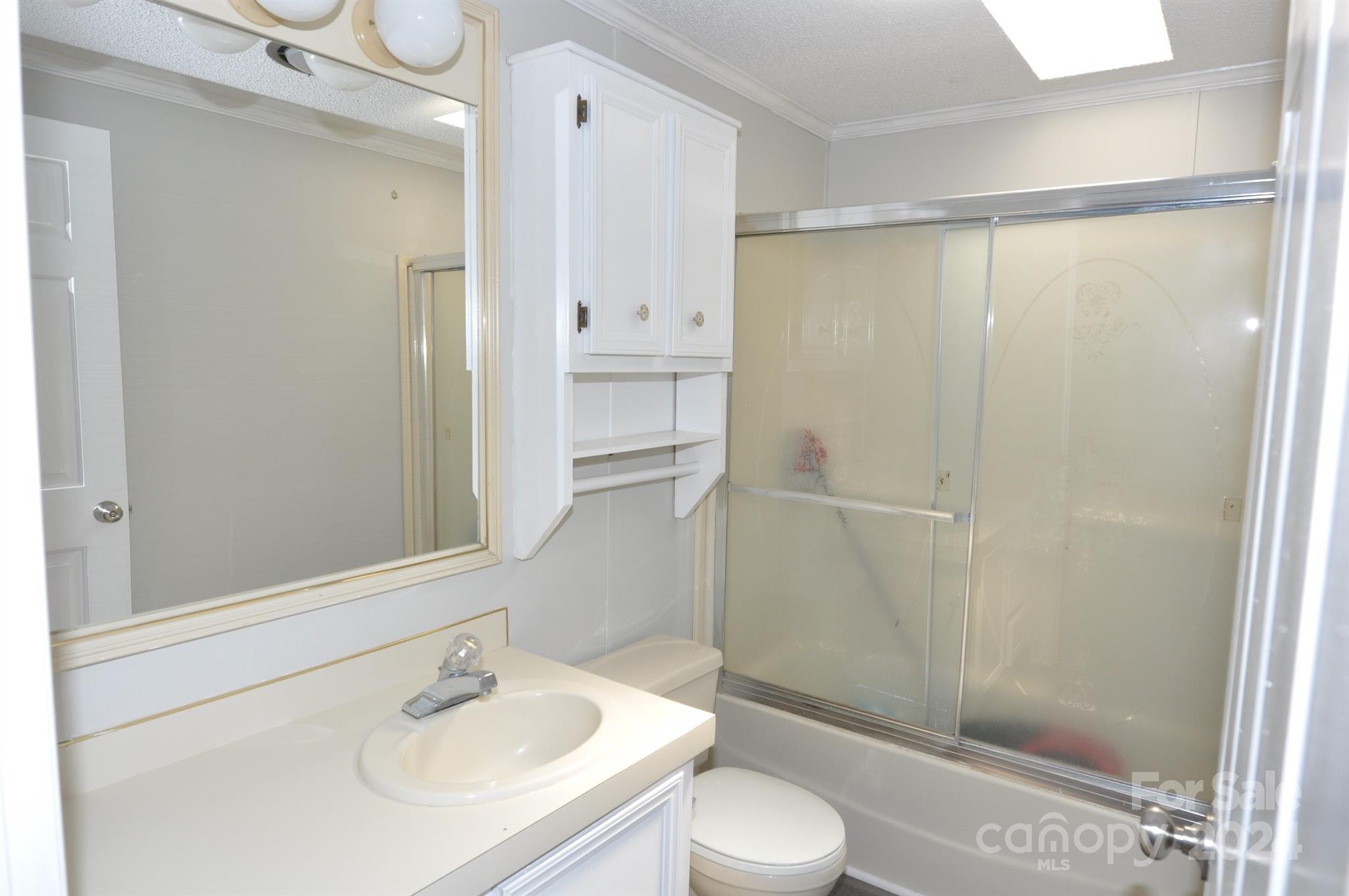 1646 Madison Road, Unit 22 Chester, SC 29706 - Photo 21 of 24 a bathroom with a sink a toilet and shower