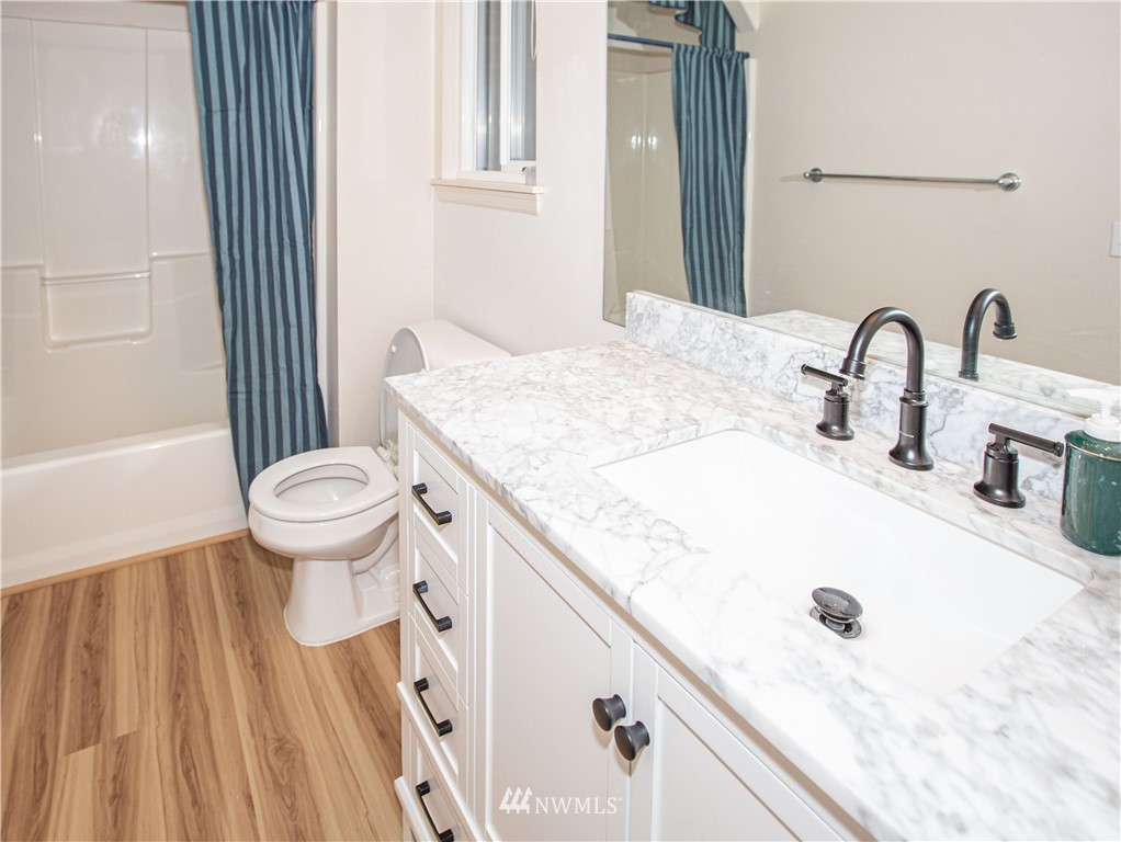 20405 28th Avenue Southeast Bothell, WA 98021 - Photo 4 of 9 a bathroom with a sink and a toilet