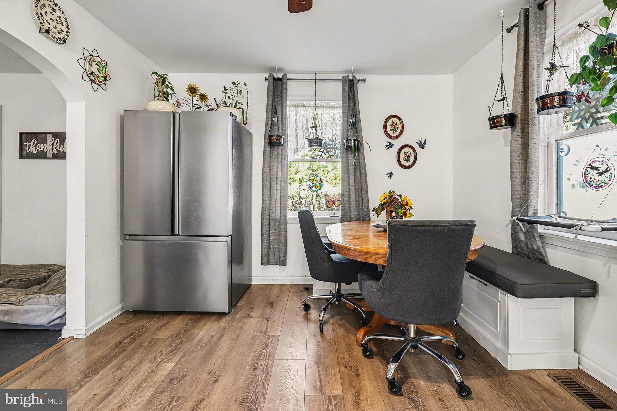 2033 Courthouse Road Heathsville, VA 22473 - Photo 12 of 50 a view of a dining room with furniture window and wooden floor