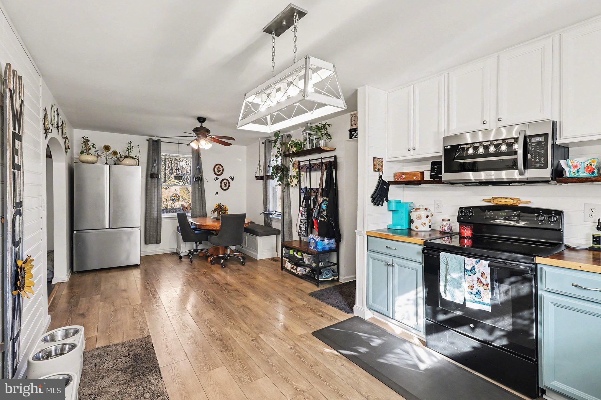 2033 Courthouse Road Heathsville, VA 22473 - Photo 13 of 50 a kitchen with stainless steel appliances granite countertop a refrigerator stove and sink