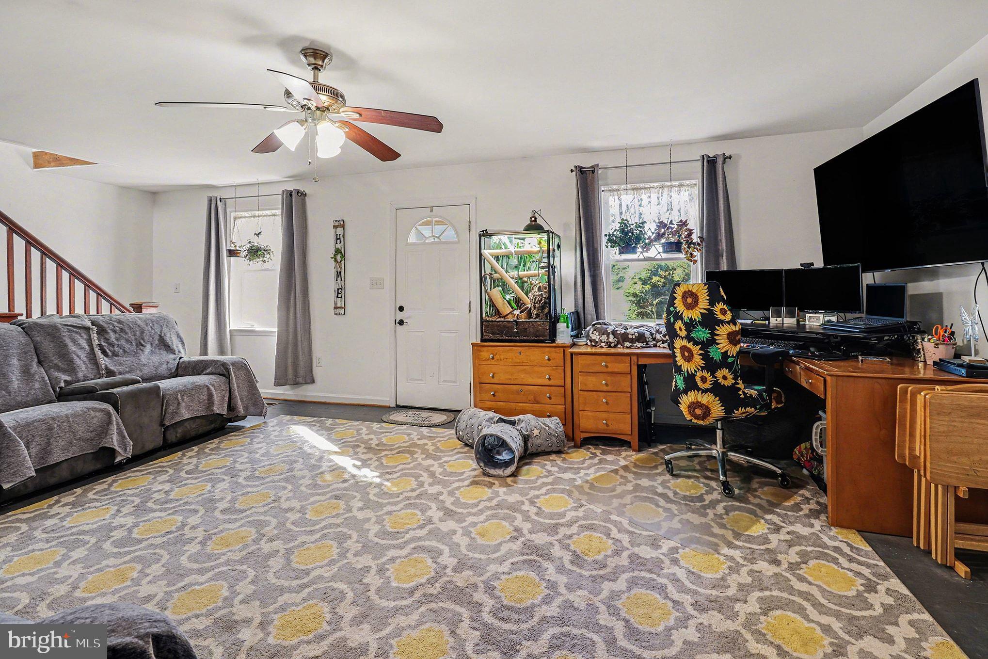 2033 Courthouse Road Heathsville, VA 22473 - Photo 15 of 50 a bedroom with furniture and a flat screen tv