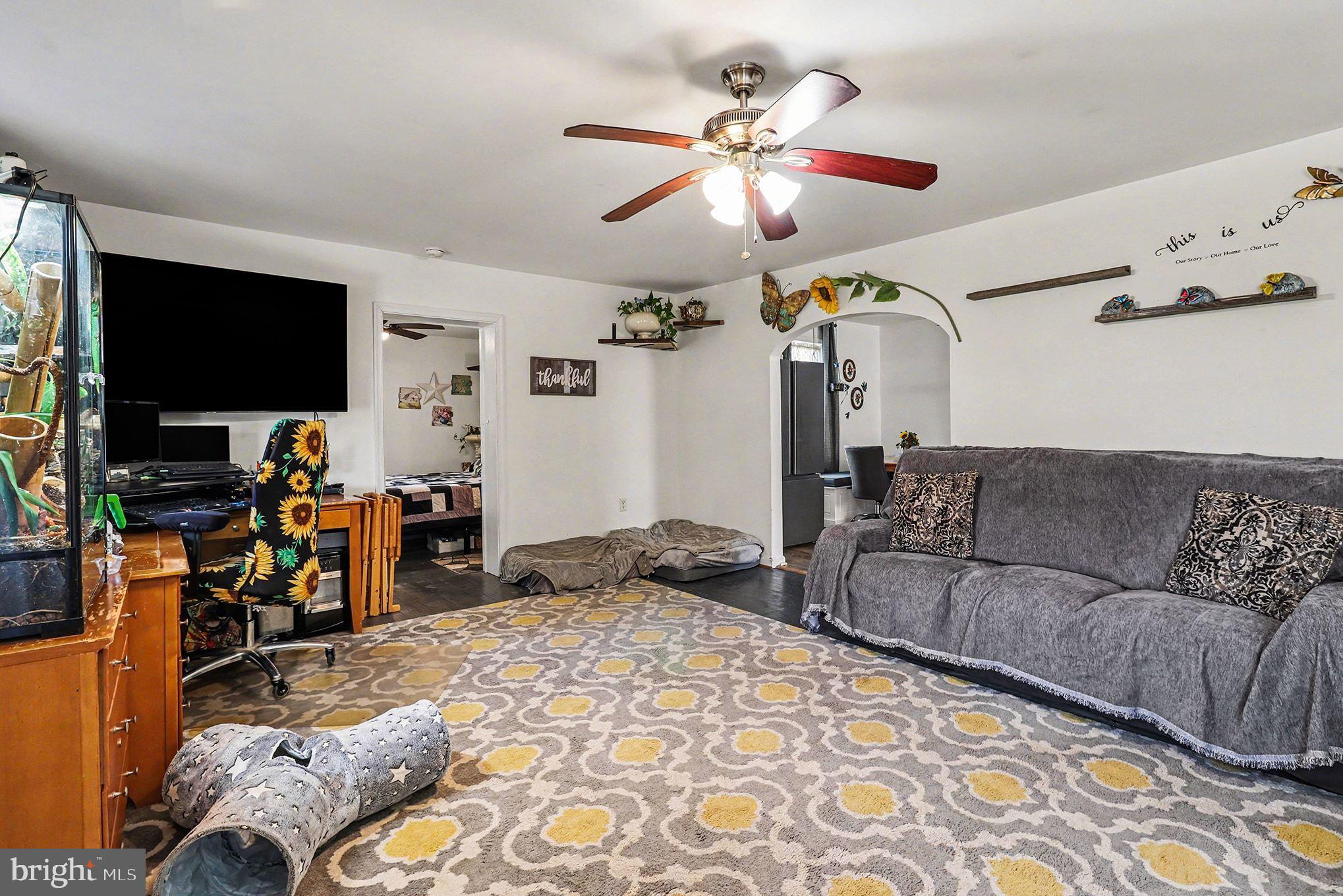 2033 Courthouse Road Heathsville, VA 22473 - Photo 16 of 50 a living room with furniture and a flat screen tv