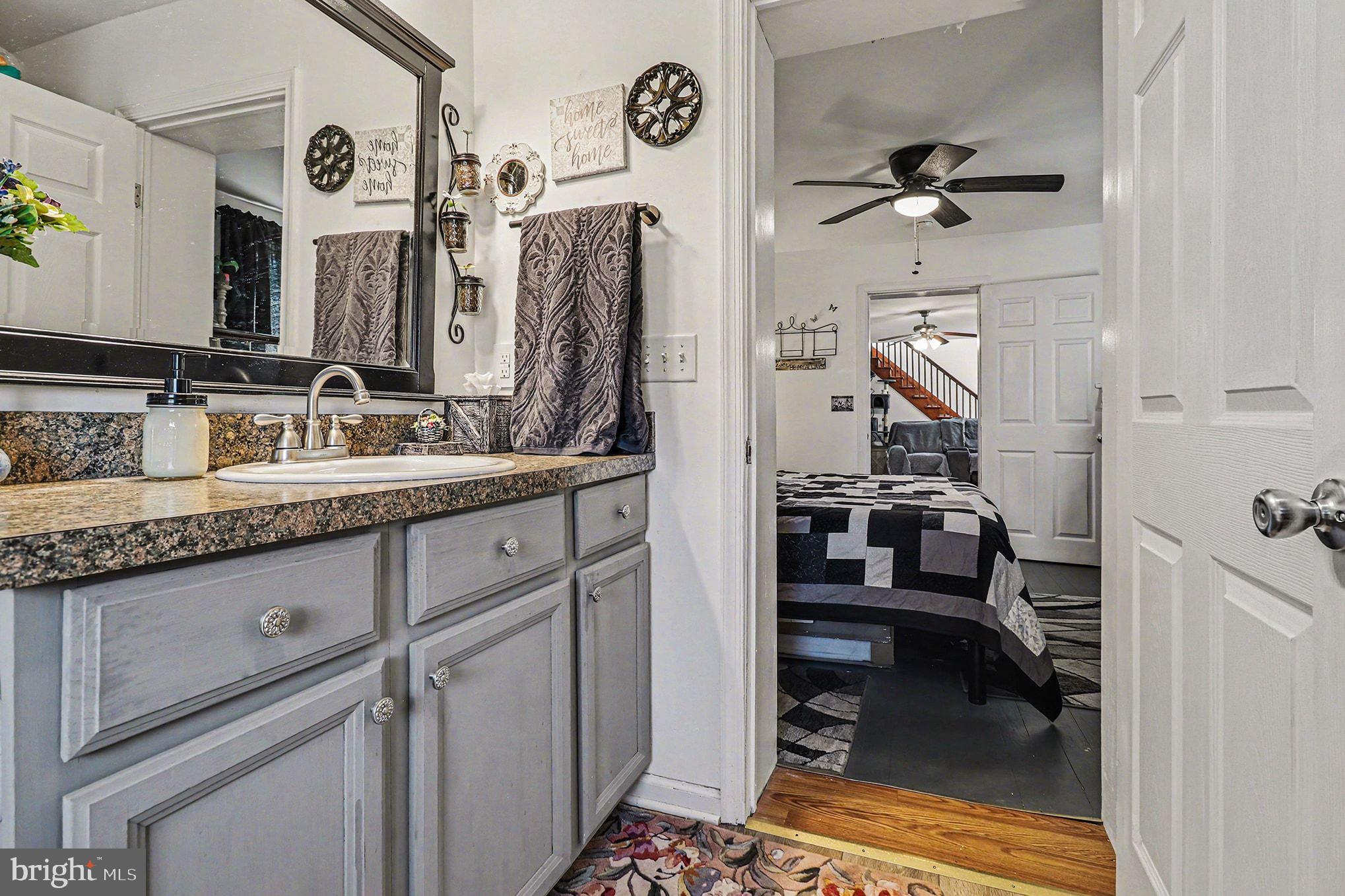 2033 Courthouse Road Heathsville, VA 22473 - Photo 19 of 50 a en suite bathroom with a sink and a mirror