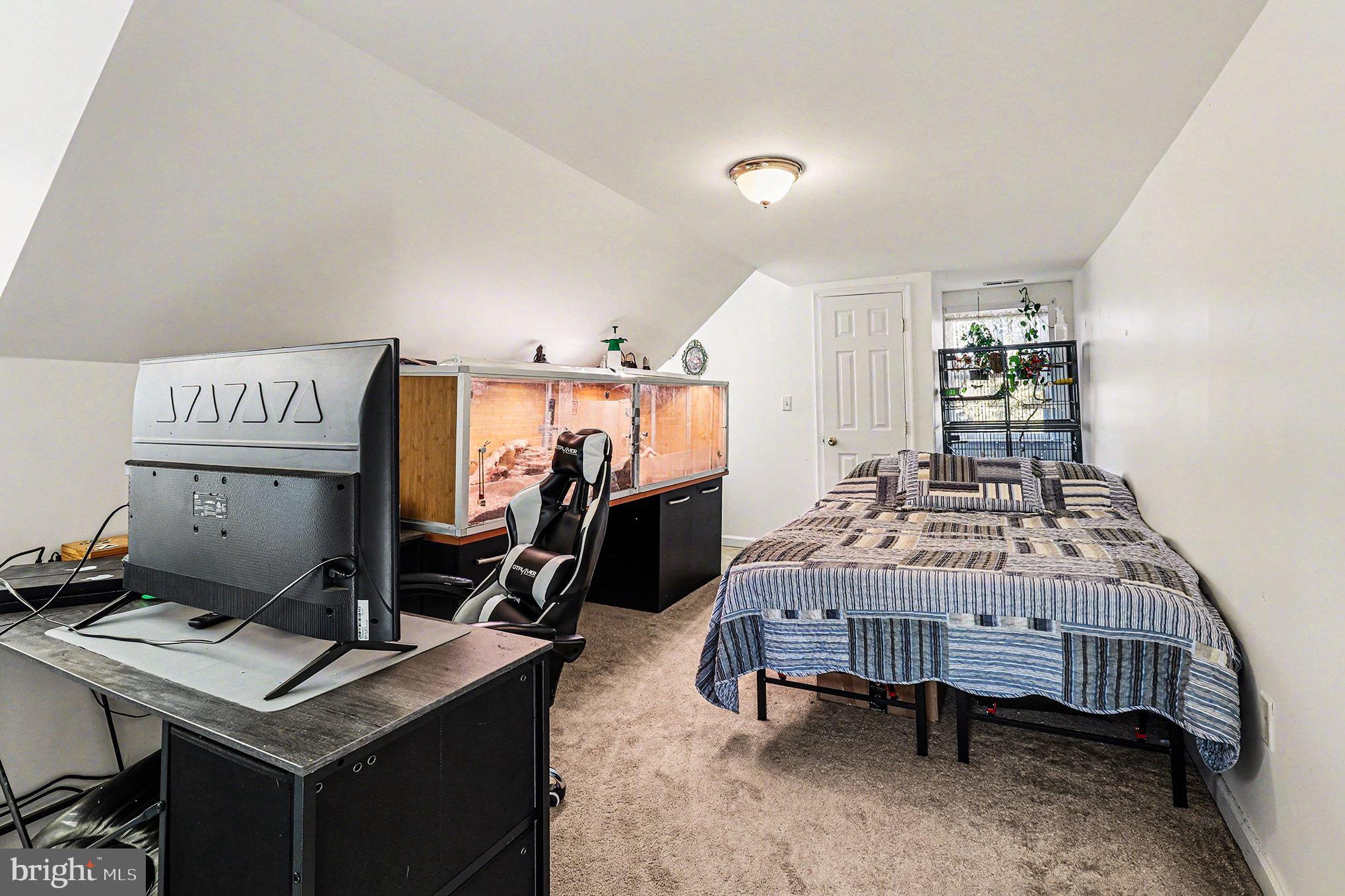 2033 Courthouse Road Heathsville, VA 22473 - Photo 21 of 50 a bedroom with a bed and a desk