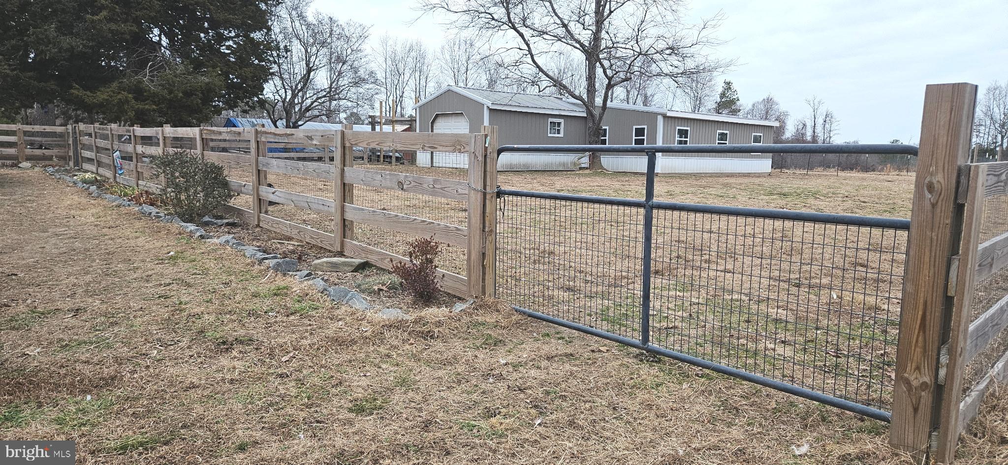 2033 Courthouse Road Heathsville, VA 22473 - Photo 36 of 50 a view of a yard and a wooden fence