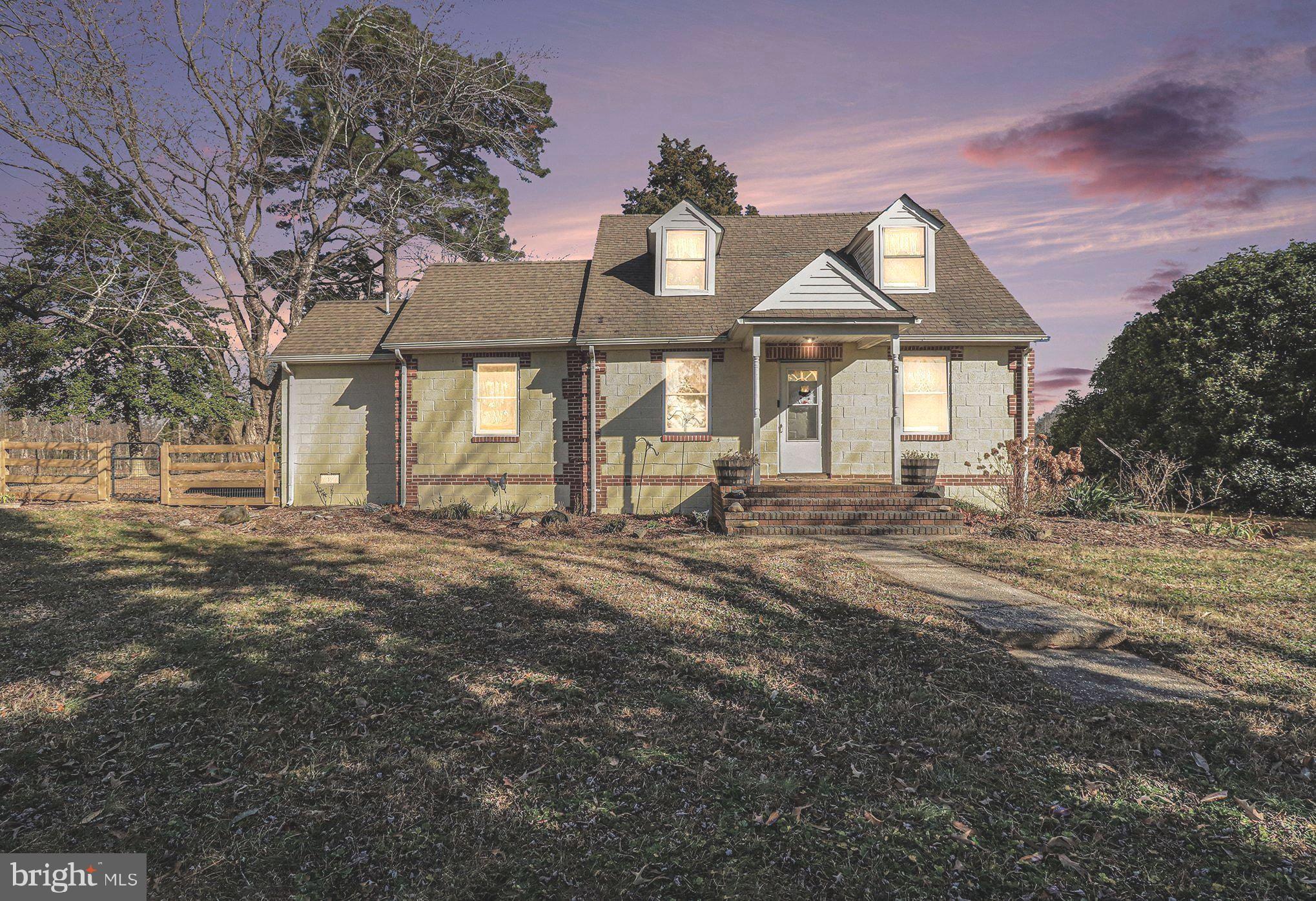 2033 Courthouse Road Heathsville, VA 22473 - Photo 4 of 50 a front view of a house with a garden