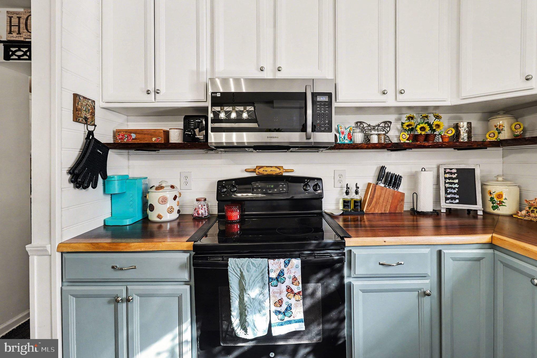 2033 Courthouse Road Heathsville, VA 22473 - Photo 9 of 50 a kitchen with stainless steel appliances granite countertop a stove and a cabinets