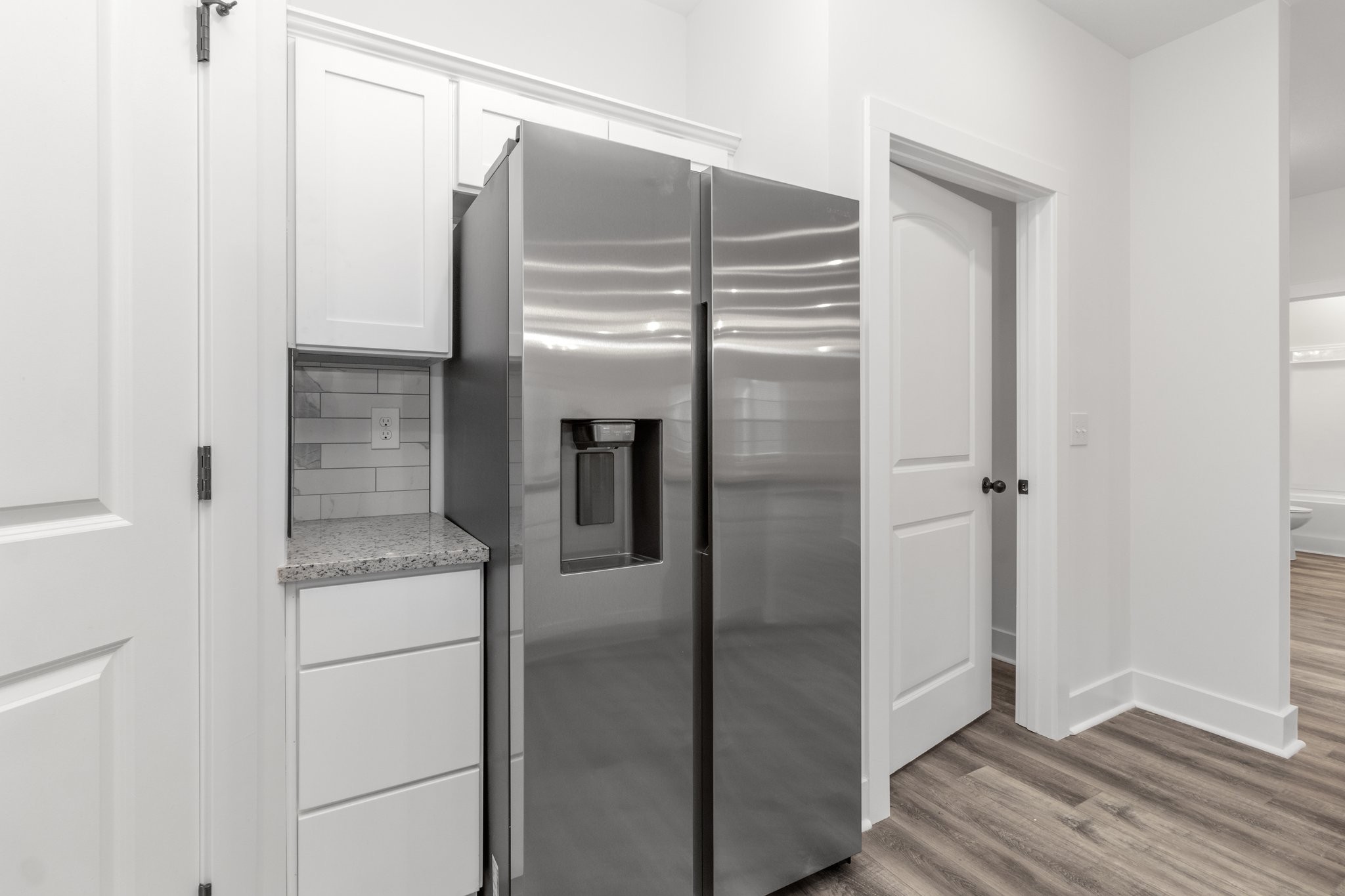297 Wayne Hall Road Clarksville, TN 37040 - Photo 11 of 35 a kitchen with a refrigerator and cabinets
