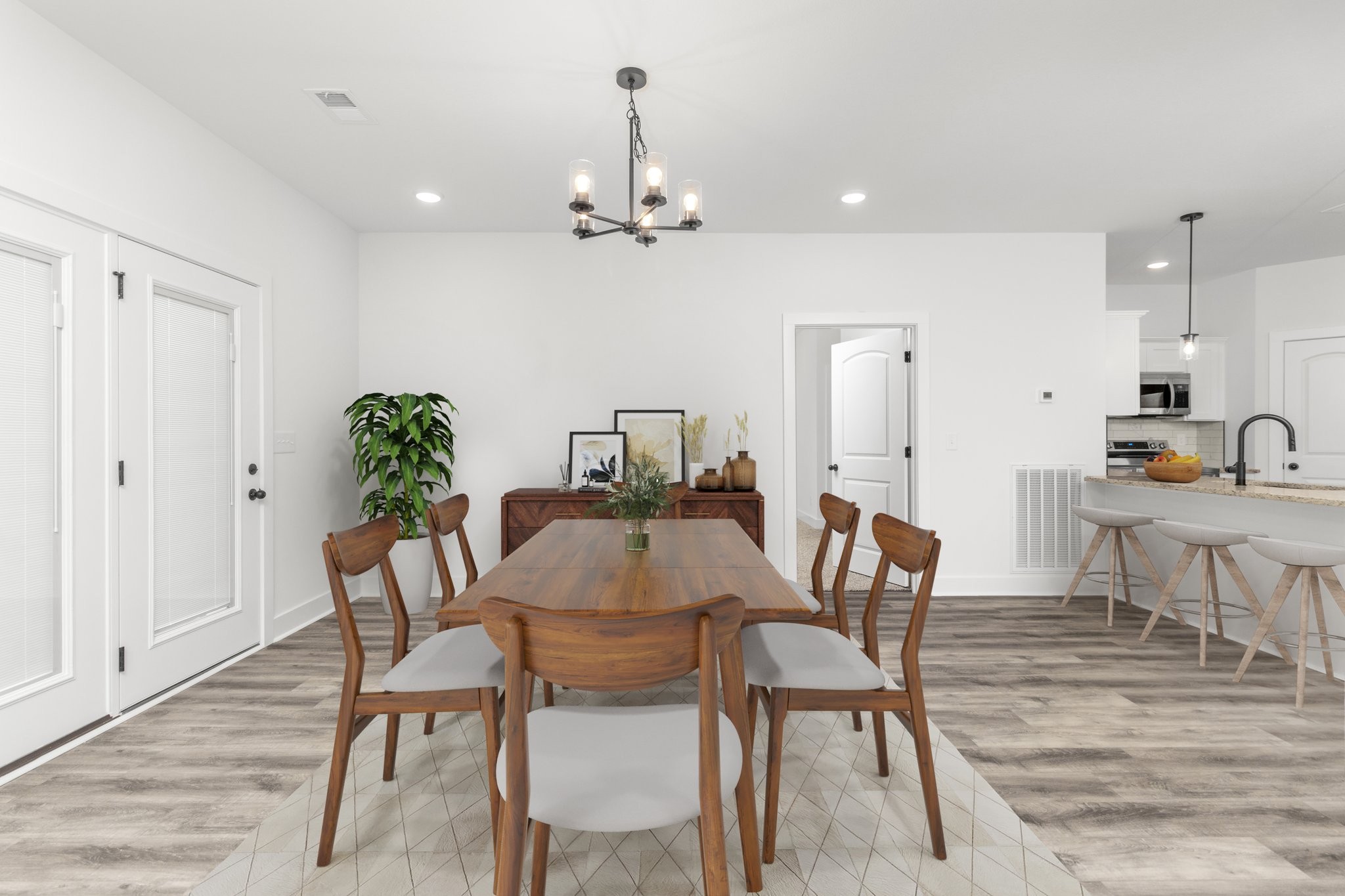 297 Wayne Hall Road Clarksville, TN 37040 - Photo 16 of 35 a view of a dining room with furniture and wooden floor
