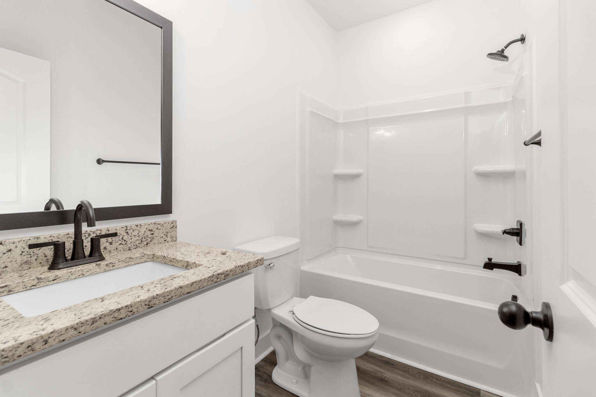 297 Wayne Hall Road Clarksville, TN 37040 - Photo 22 of 35 a bathroom with a granite countertop sink a toilet and bathtub