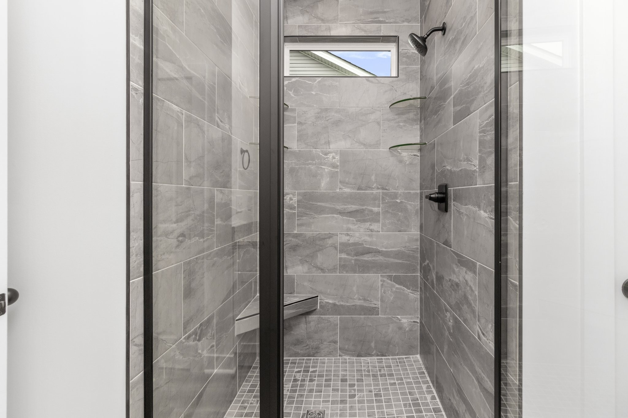 297 Wayne Hall Road Clarksville, TN 37040 - Photo 29 of 35 a bathroom with a glass shower door