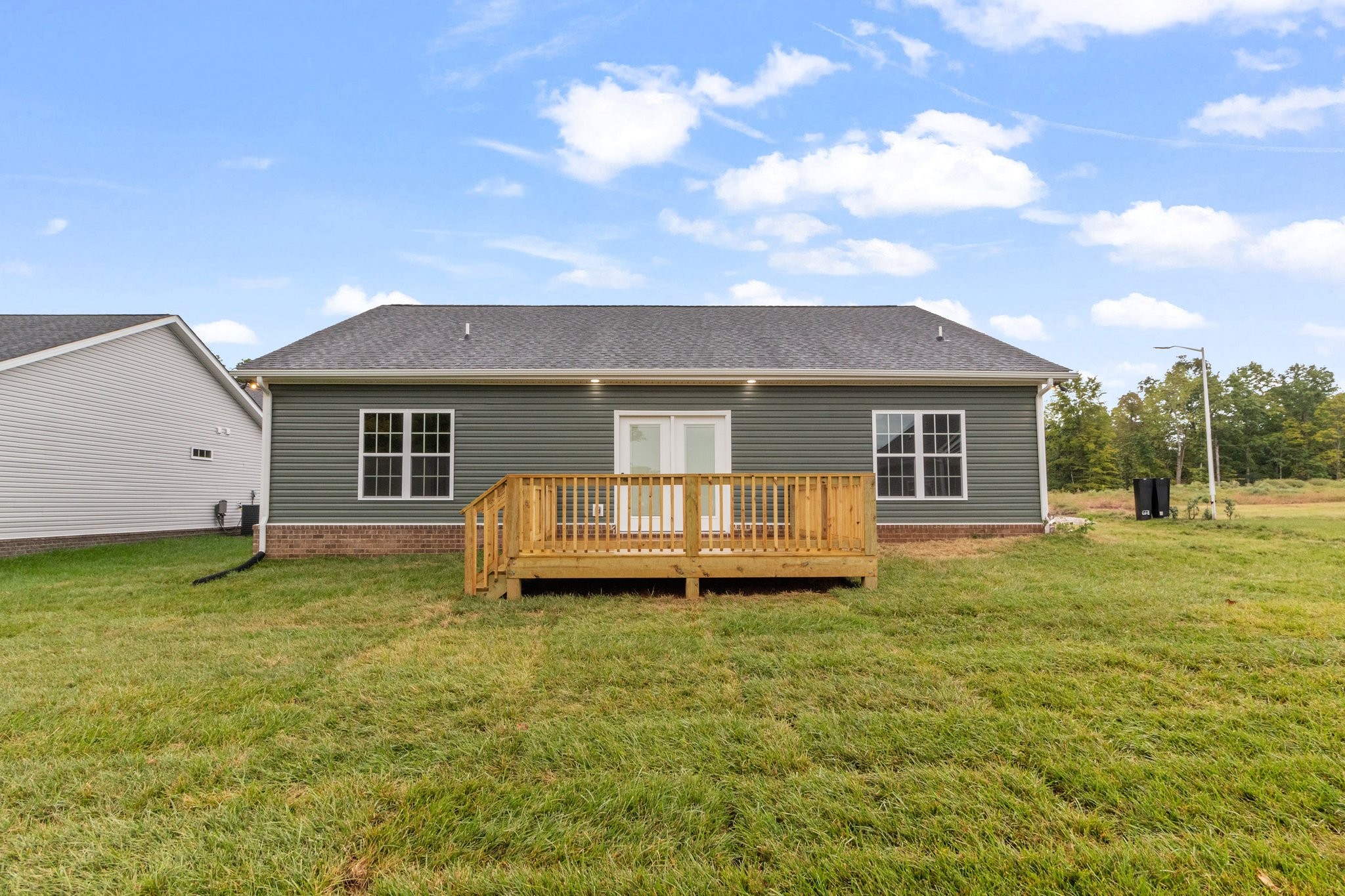 297 Wayne Hall Road Clarksville, TN 37040 - Photo 33 of 35 a view of a house with a yard