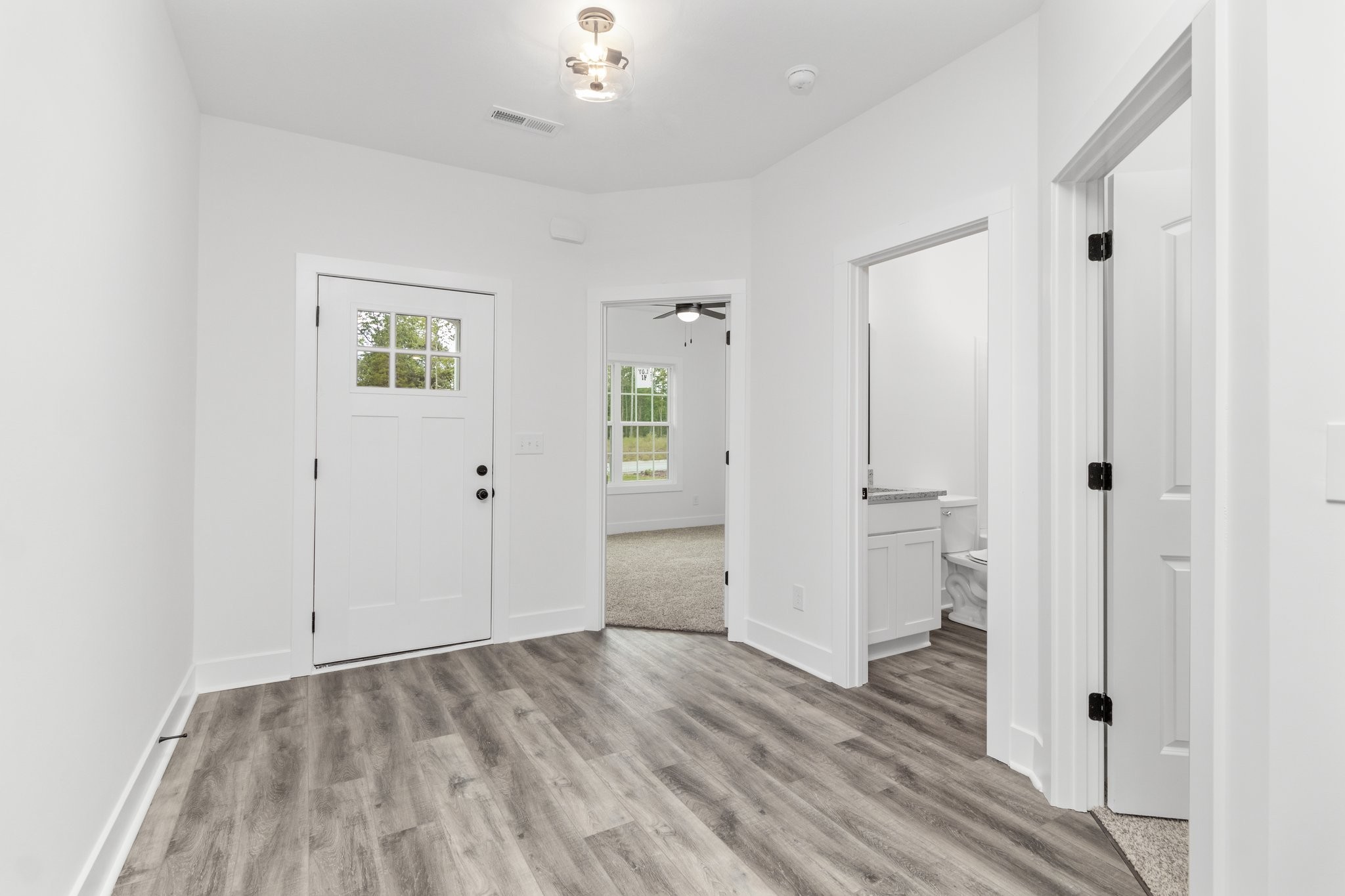 297 Wayne Hall Road Clarksville, TN 37040 - Photo 4 of 35 wooden floor with white walls