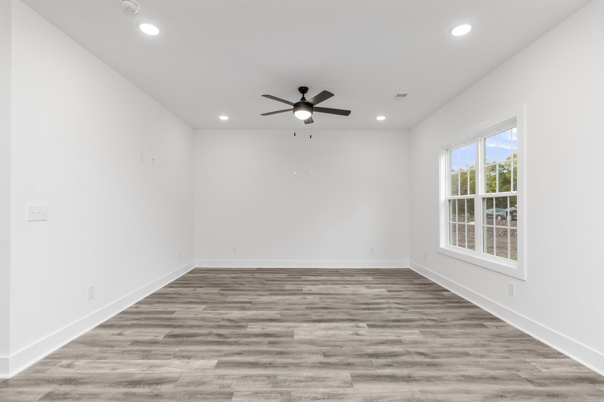 297 Wayne Hall Road Clarksville, TN 37040 - Photo 6 of 35 wooden floor in an empty room with a window