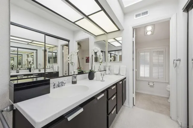 a kitchen with a sink appliances and cabinets