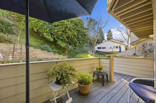 a balcony with wooden floor