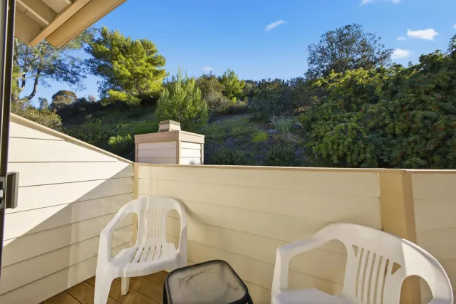 a view of balcony and yard