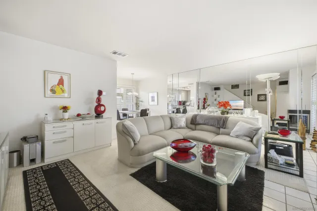 a living room with furniture and a rug