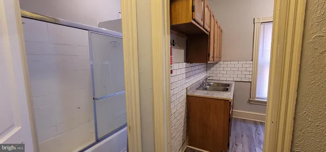 a kitchen with a refrigerator and a stove
