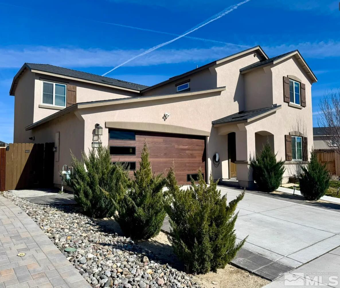 8908 Quail Falls Drive Reno, NV 89506 - Photo 2 of 20 a front view of a house with garden