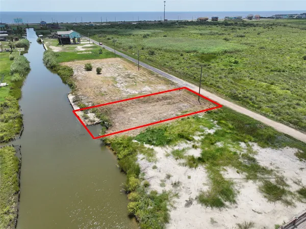 a view of a field with an ocean view