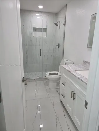 an empty room with wooden floor