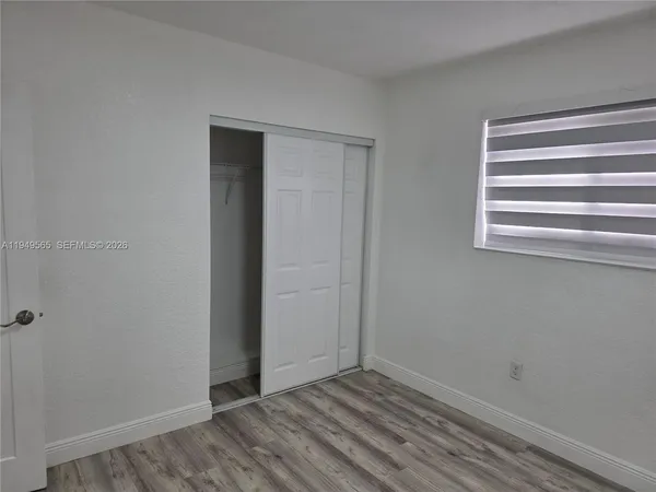 a view of kitchen with wooden floor