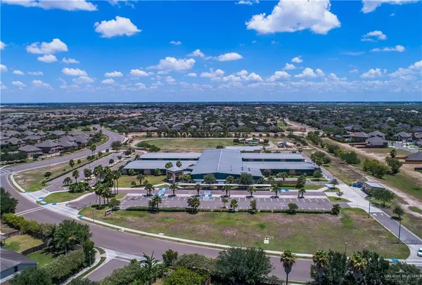 an aerial view of a residential houses with outdoor space